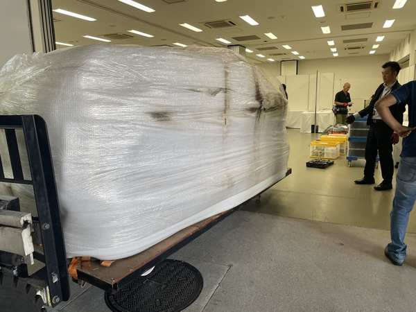 Moving wrapped vehicle into exhibition hall